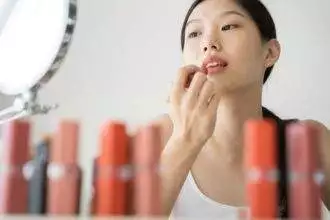 Asian female makeup beauty by lipstick.