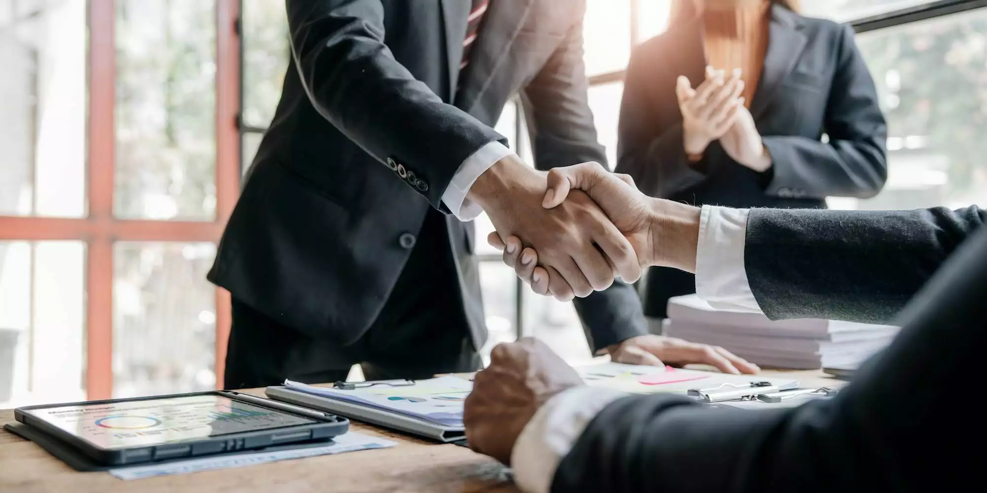 Business people shaking hands, finishing up meeting, business etiquette, congratulation, merger and