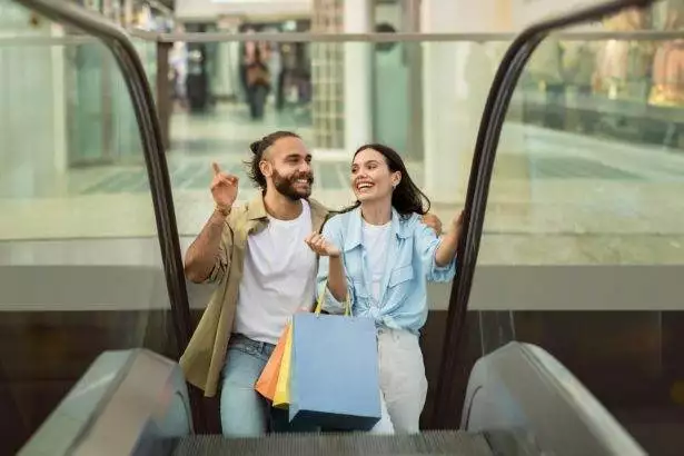 Glad millennial european family shopaholics customers with many packages enjoy walk, customer