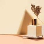 niche luxury perfumery boutique, perfume fragnance in glass vial, standing on a a podium made