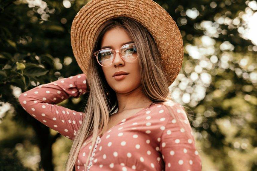 Stylish young woman in summer park